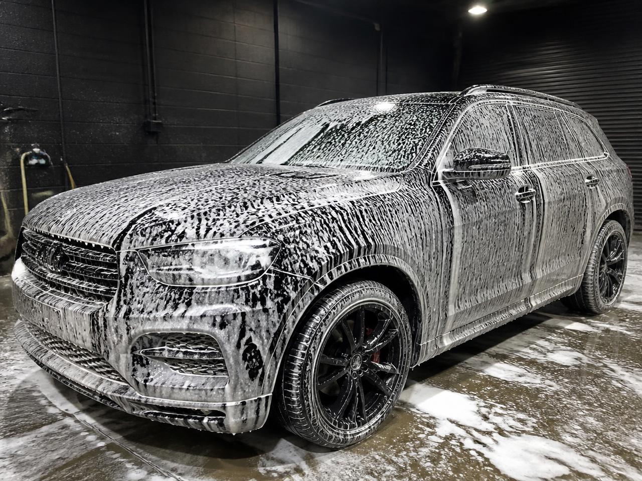 SUV covered in foam during a hand wash